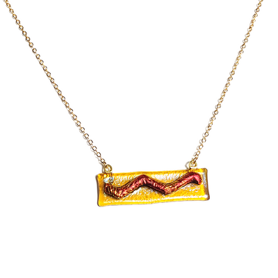 Dichroic red wave on amber fused glass bar necklace