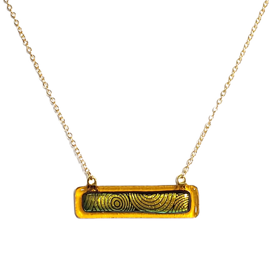 Dichroic yellow circles on amber fused glass bar necklace