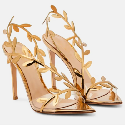 Elegant women’s golden stiletto high-heeled sandals